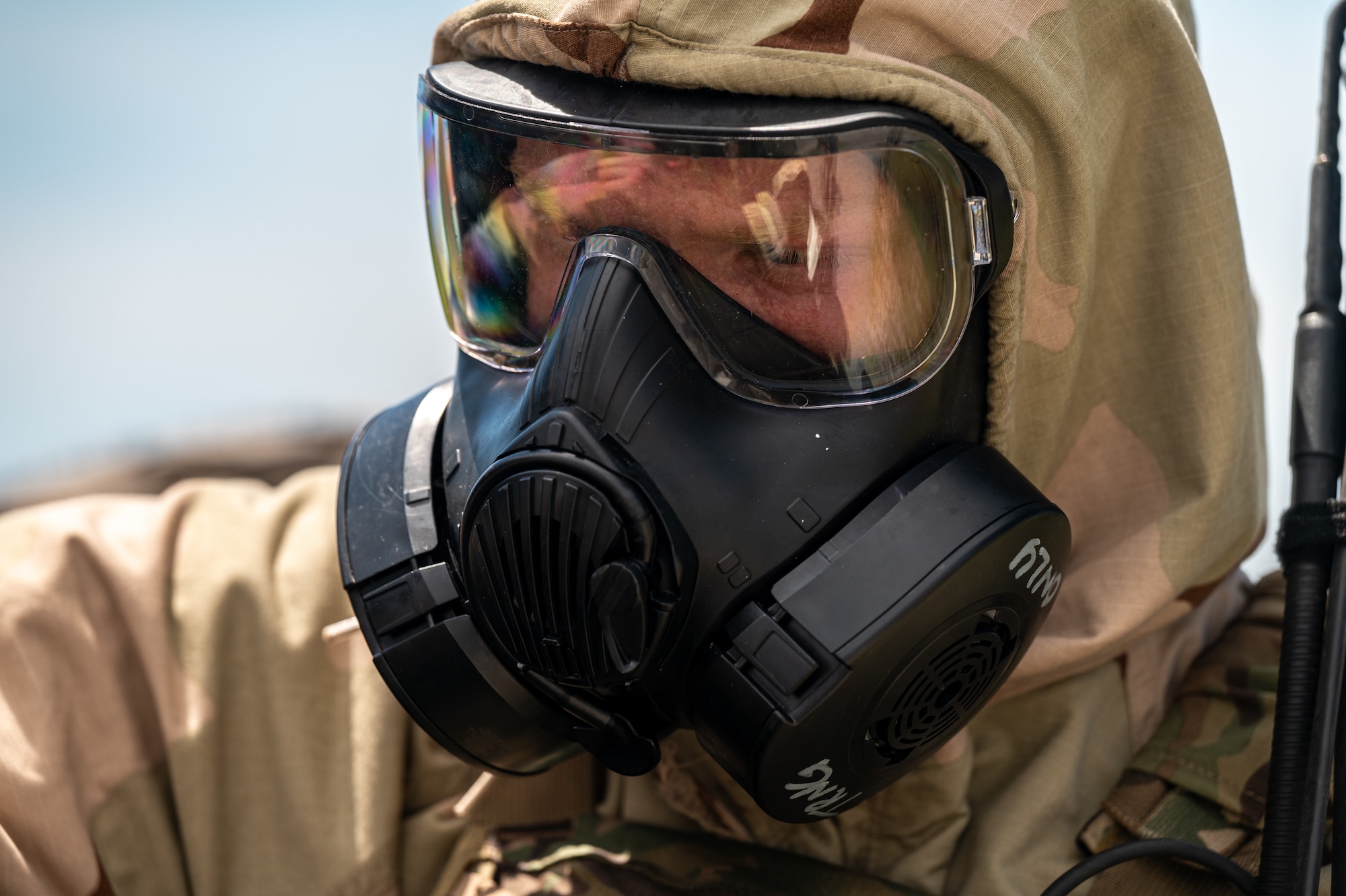 An airmen dons protective gear