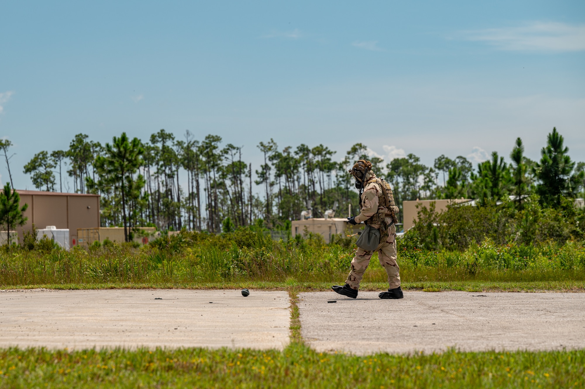 An airman walks towards an explosive