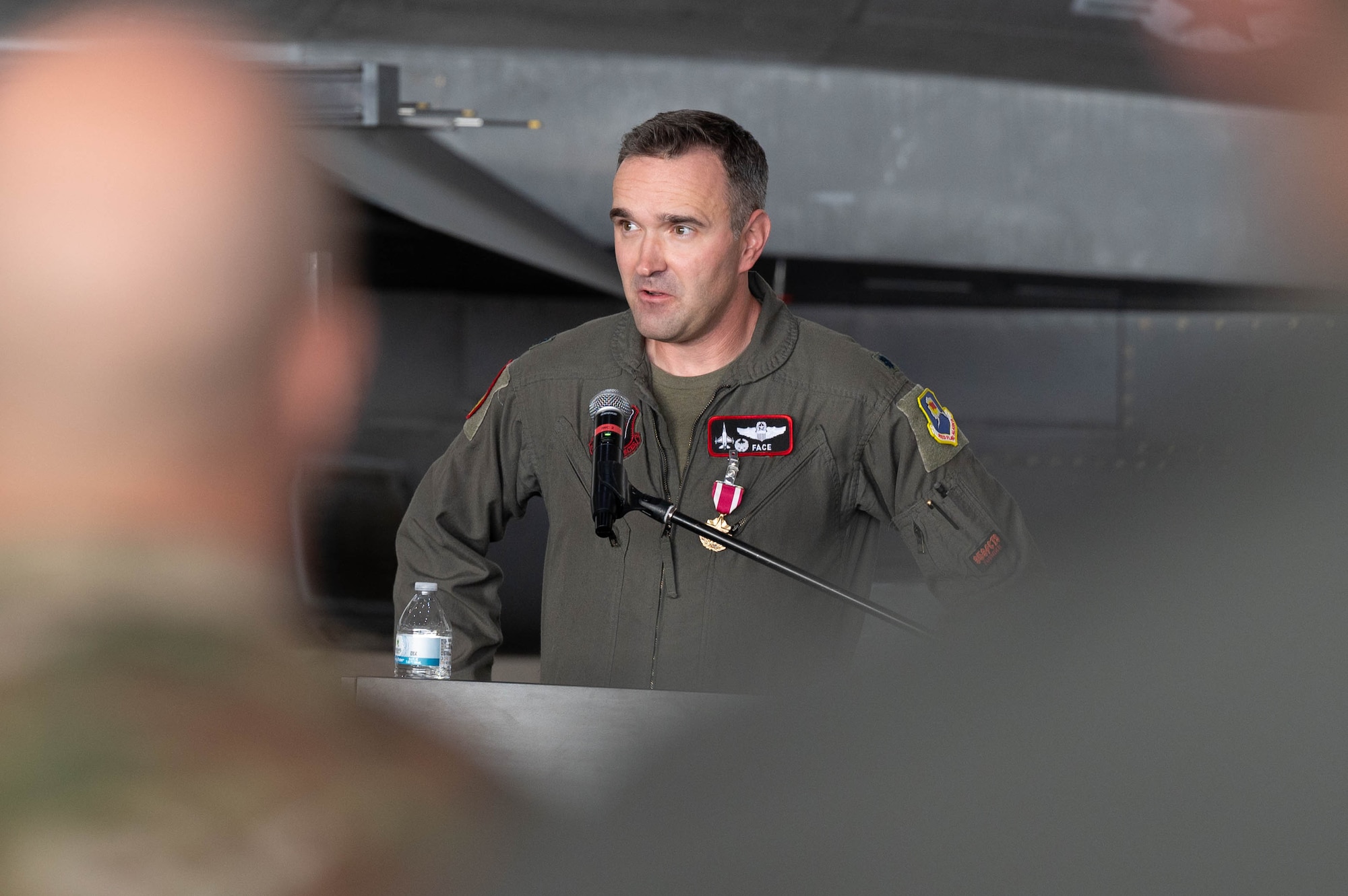 U.S. Air Force Lt. Col. James Collins II, 353rd Combat Training Squadron outgoing commander, delivers remarks during a change of command ceremony at Eielson Air Force Base, Alaska, Sep. 6, 2024.