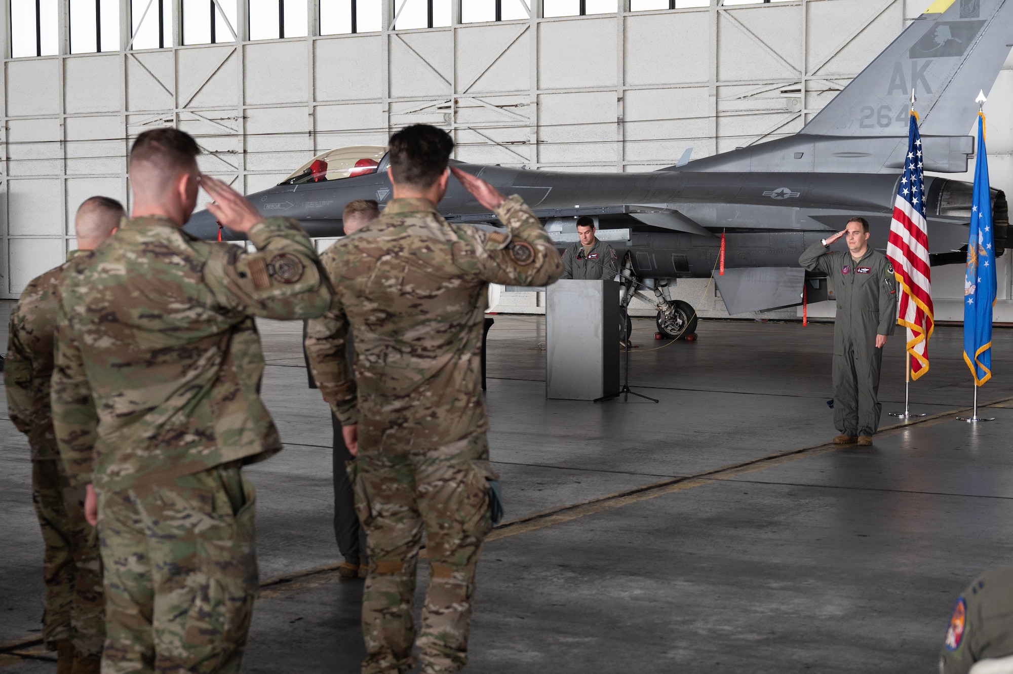 U.S. Air Force Lt. Col. Eric Hakos, 353rd Combat Training Squadron incoming commander, renders an initial salute to the formation during a change of command ceremony at Eielson Air Force Base, Alaska, Sep. 6, 2024.