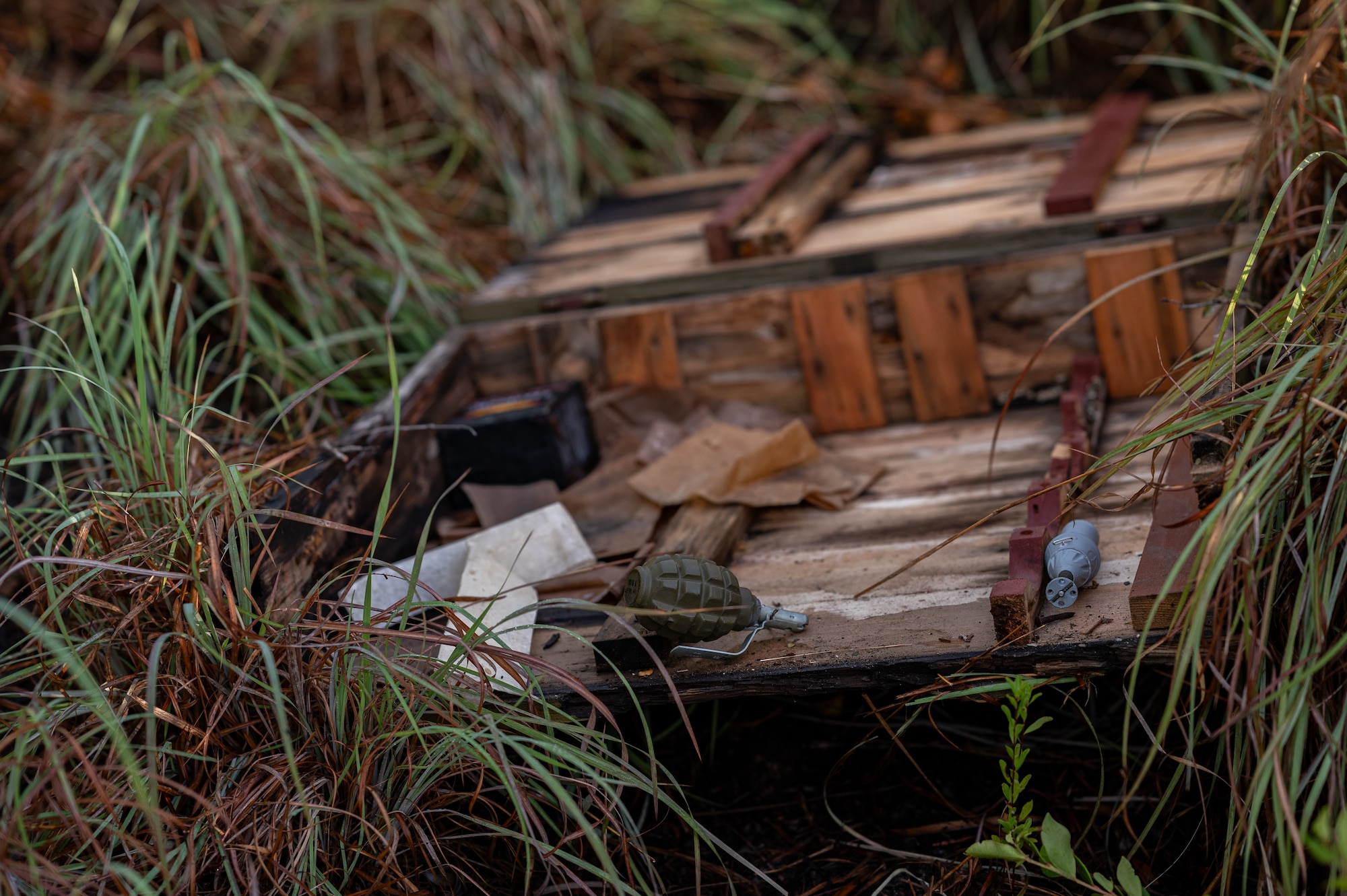 A box of items sit on the ground