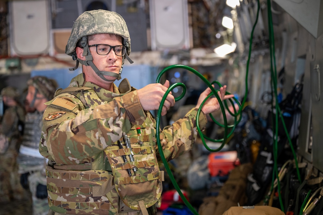 Tech. Sgt. Trey Naber, 445th Aeromedical Evacuation Squadron AE technician, prepares the oxygen line aboard a 445th Airlift Wing C-17 Globemaster III during Exercise Patriot Medic 2024 at Fort McCoy Army Airfield, Aug. 10, 2024. The training and scenarios participants played during the exercise validated Reserve capabilities to employ en route care and use of the Theater Aeromedical Evacuation System (TAES). (U.S. Air Force photo by Tech. Sgt. Timothy Leddick)