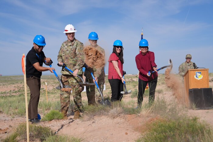 From left: Frank Garcia, CEO, Perikin Enterprises LLC; U.S. Space Force Col. Jeremy Raley, director of the Space Vehicles Directorate, Air Force Research Laboratory, or AFRL; U.S. Army Maj. Jerard Paden, deputy district commander, U.S. Army Corps of Engineers, South Pacific Division, Albuquerque District; Stephanie Eddy, nuclear deterrence portfolio lead for the Nuclear Mission branch, AFRL; and Maria Mendoza, chief, Facilities Management section, AFRL, break ground during a ceremony, July 29, 2024, at Kirtland Air Force Base, N.M. The groundbreaking marked the commencement of construction for the Re-Entry Vehicle Integration Laboratory, or REVIL, that will serve AFRL’s Nuclear Mission branch and provide a state-of-the-art lab space for integrating test units for next-generation nuclear research and technology. (U.S. Air Force photo /Jessie Perkins)