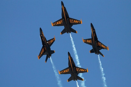 Diamond pilots assigned to the U.S. Navy flight demonstration squadron, the Blue Angels, perform the barrel role break maneuver during the Fort Worth Air Power Expo at Naval Air Station Joint Reserve Base Fort Worth.