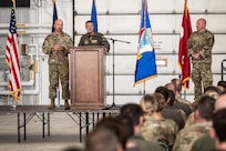 Col. Nelson Perron, the commander of the 157th Air Refueling Wing, and Chief Master Sgt. Kevin Reiter, command chief of the 157th ARW, address Airmen assigned to the wing during a pre-deployment ceremony Sept. 8, 2024, at Pease Air National Guard Base, New Hampshire.