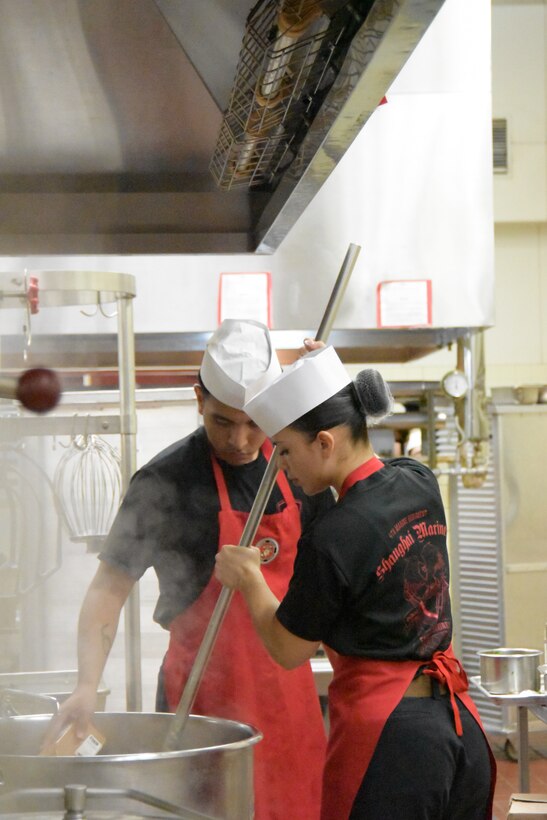 Marines assigned to Camp Schwab, (left to right) Lance Cpl. Alexis Martinez Nulasco and Cpl. Yesenia Ramos work together during the Marine Corps Installations Pacific’s Food Services Specialist of the Quarter competition, held at Combined Arms Training Center, Camp Fuji, August 30, 2024. The team won 3rd Place. (U.S. Marine Corps photo by Song Jordan)