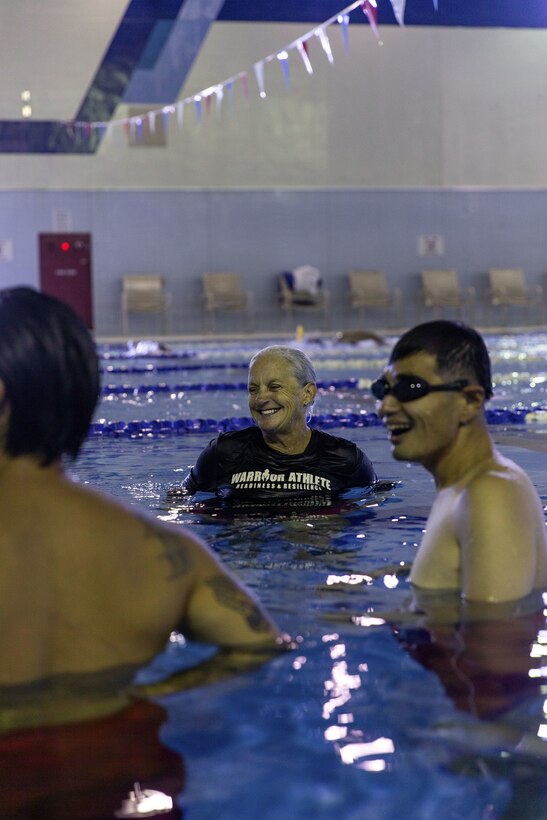 Jennifer Ayers, the Marine Corps Air Station Iwakuni aquatics director and a South Carolina native, trains swim instructors in the Marine Corps Community Services’ indoor pool on Sept. 4, 2024. Ayers and the MCAS Iwakuni aquatics team provide swim clinics and master classes, and train instructors with the goal to improve service members’ survival skills and increase their water confidence. (U.S. Marine Corps photo by Sgt. Phuchung Nguyen)