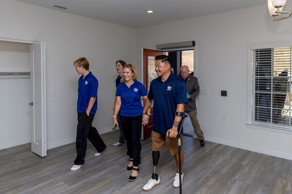 ESCONDIDO, Calif. -- Naval Medical Center San Diego’s lead prosthetist, Nathaniel “Randell” Leoncio, is presented with a custom home in Escondido, Calif., from the Homes For Our Troops non-profit organization, Aug. 24, 2024.  Leoncio, accompanied by his family, set foot for the first time in their new residence.  The mission of NMCSD is to prepare service members to deploy in support of operational forces, deliver high quality health care services, and shape the future of military medicine through education, training, and research. NMCSD employs more than 5,000 active-duty military personnel, civilians and contractors in southern California to provide patients with world-class care. Anchored in Excellence, Committed to Health!