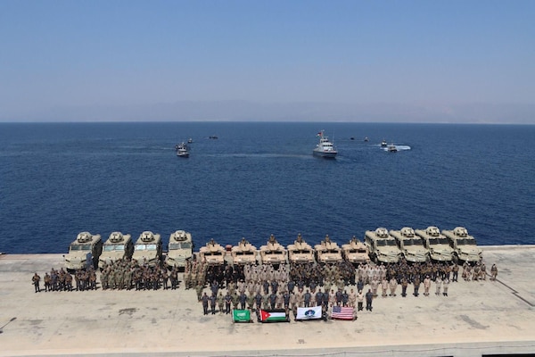 AQABA, JORDAN (May 12, 2024) – Participants of Eager Lion 2024 pose for an inauguration photo at Jordan Naval Base, Aqaba, Jordan, May 12, 2024. Eager Lion is designed to exchange military expertise, improve interoperability among partner nations, and considered the capstone of a broader U.S. military relationship with the Jordanian Armed Forces. (U.S. Army Photo by PFC Abraham Gomez/Released)