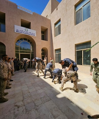 AQABA, JORDAN (May 14, 2024) – Tactical Casualty Combat Care participants demonstrate fireman’s carry during an Eager Lion 2024 skill assessment session, May 14, 2024. Eager Lion is designed to exchange military expertise, improve interoperability among partner nations, and considered the capstone of a broader U.S. military relationship with the Jordanian Armed Forces.  (U.S. Navy photo by Lt. Fremmy Cuadra/Released)