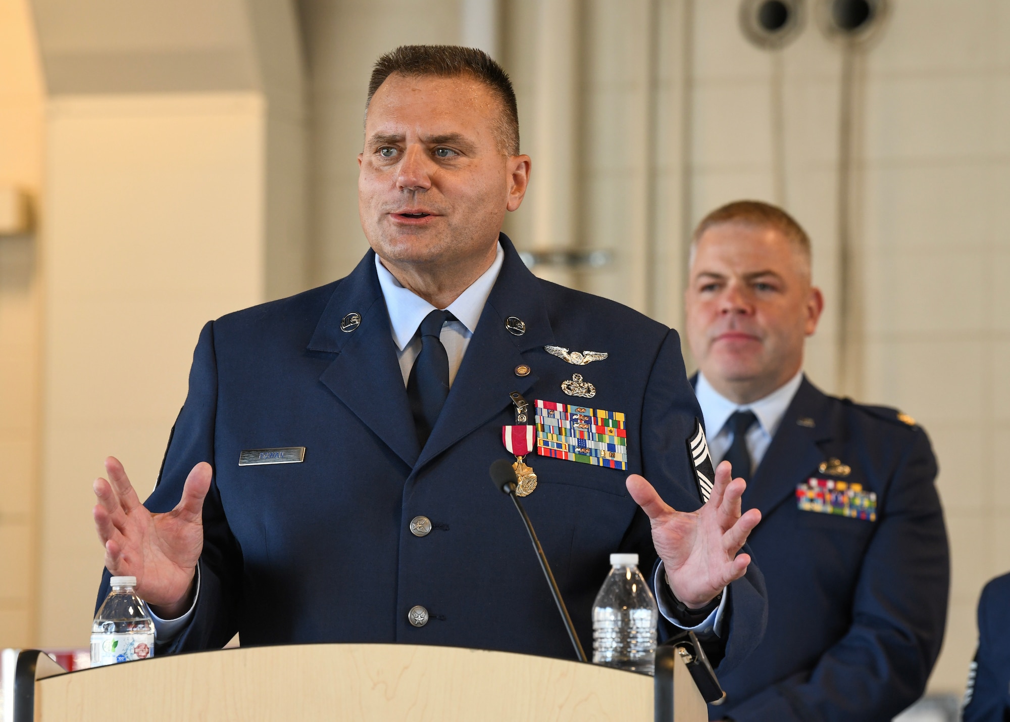 New York Air National Guard Chief Master Sgt. Harold L. Rowan, the human resources advisor of the 106th Rescue Wing, Francis S. Gabreski Air National Guard Base, Westhampton Beach, New York Air National Guard, speaks during his retirement ceremony on base, Sept. 8, 2024. Rowan served at the 106th for approximately 35 years of his 41 years of military career and received the Presidential Certificate of Appreciation for his dedicated service and contributions in keeping America safe. (U.S. Air National Guard photo by Tech Sgt. Daniel Farrell)