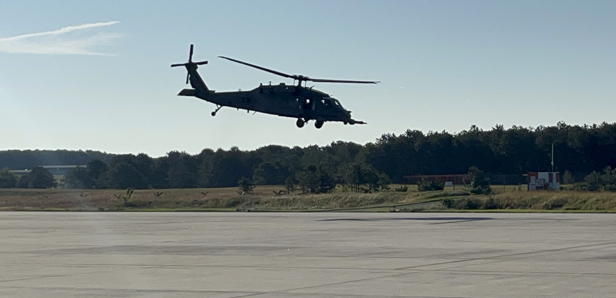 An HH-60G Pave Hawk helicopter assigned to the 101st Rescue Squadron hovers over the base flight line before being retired at Francis S. Gabreski Air National Guard Base, Westhampton Beach, N.Y., June 13, 2024. All six HH-60Gs at the 106th Rescue Wing's Rescue, 101st Rescue Squadron will be replaced with the HH-60W Jolly Green II search and rescue helicopters. (U.S. Air Force National Guard Photo by Capt. Cheran Campbell / Released)