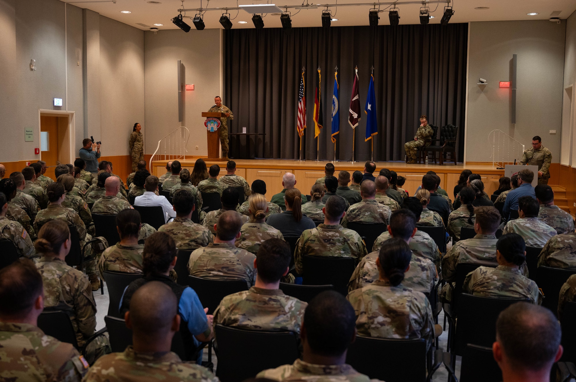 U.S. Air Force Master Sgt. Matthew Parker, 86th Medical Squadron surgical services superintendent, gives a speech after receiving a Distinguished Flying Cross from U.S. Air Force Brig. Gen. Adrienne L. Williams, 86th Airlift Wing commander, at Landstuhl Regional Medical Center, Germany, Sept. 6, 2024. Parker’s critical care expertise was pivotal to the safe transportation of 11 multi-national and joint service members, including three ventilated critical care patients, eight non-critical patients and five attendants to higher echelons of care, all while acting in response to a mass casualty evacuation operation at Hamid Karzai International Airport, Afghanistan.  (U.S. Air Force Photo by Senior Airman Jared Lovett)