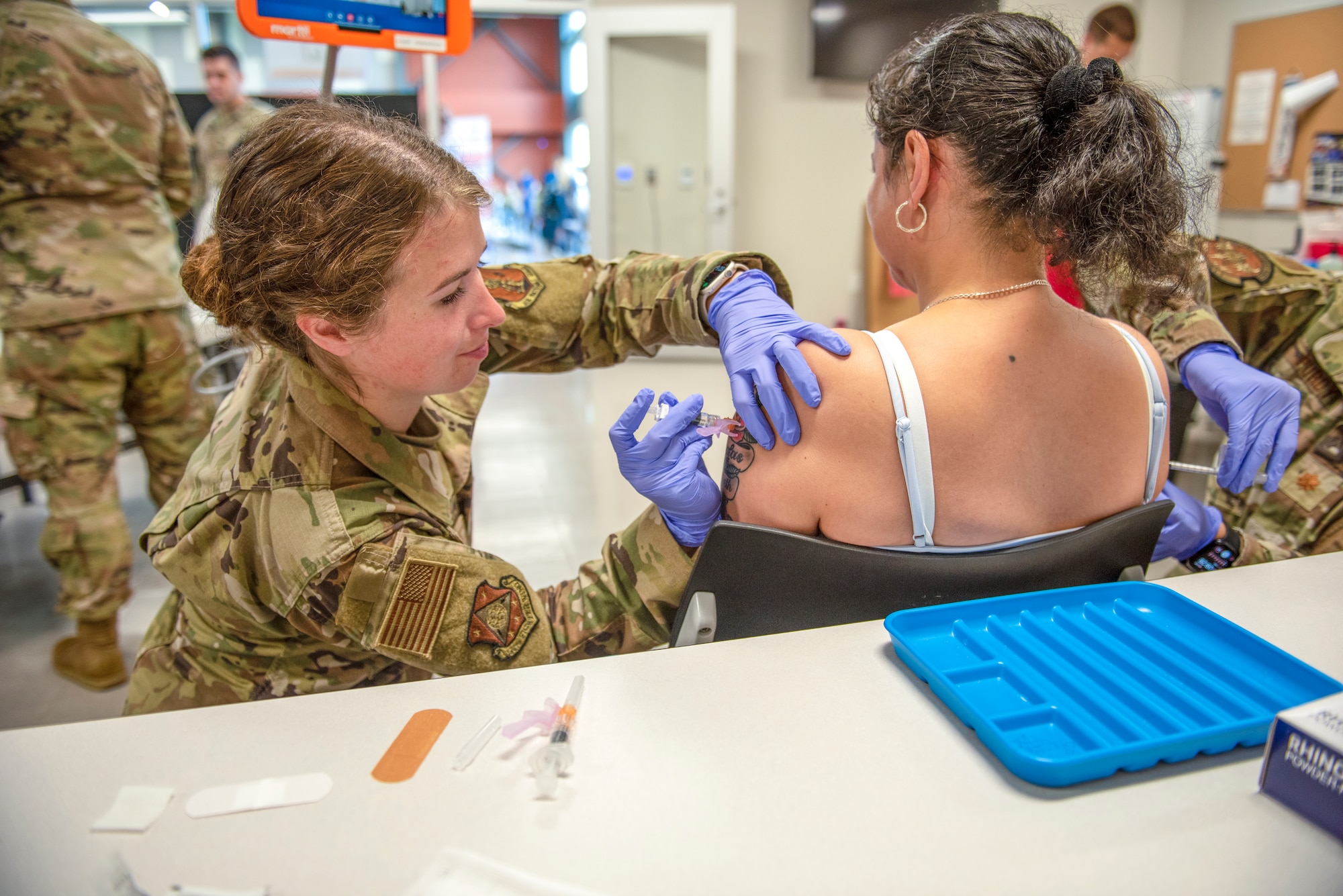 Woman gives someone a vaccine