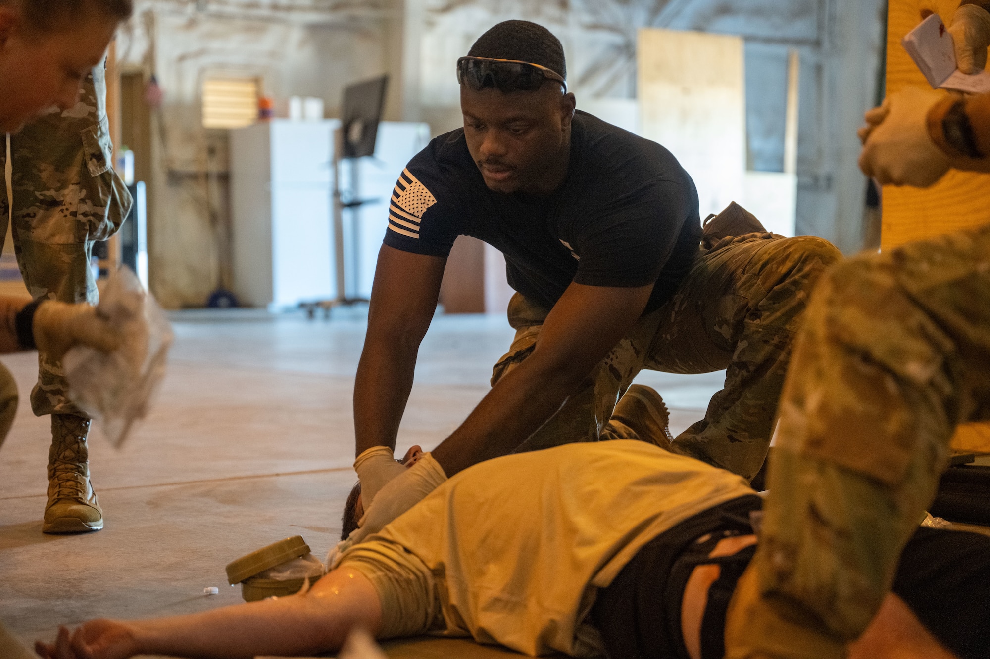 Tech. Sgt. Kevin Dodd, 349th Aerial Refueling Squadron medical element non-commissioned officer in charge, delivers medication to a simulated patient at the annual Medic Rodeo at Cannon Air Force Base, New Mexico, Aug. 13, 2024. This is the 15th iteration of the rodeo that challenged medical personnel through simulated scenarios. (U.S. Air Force photo by Senior Airman Felicia Przydzial)