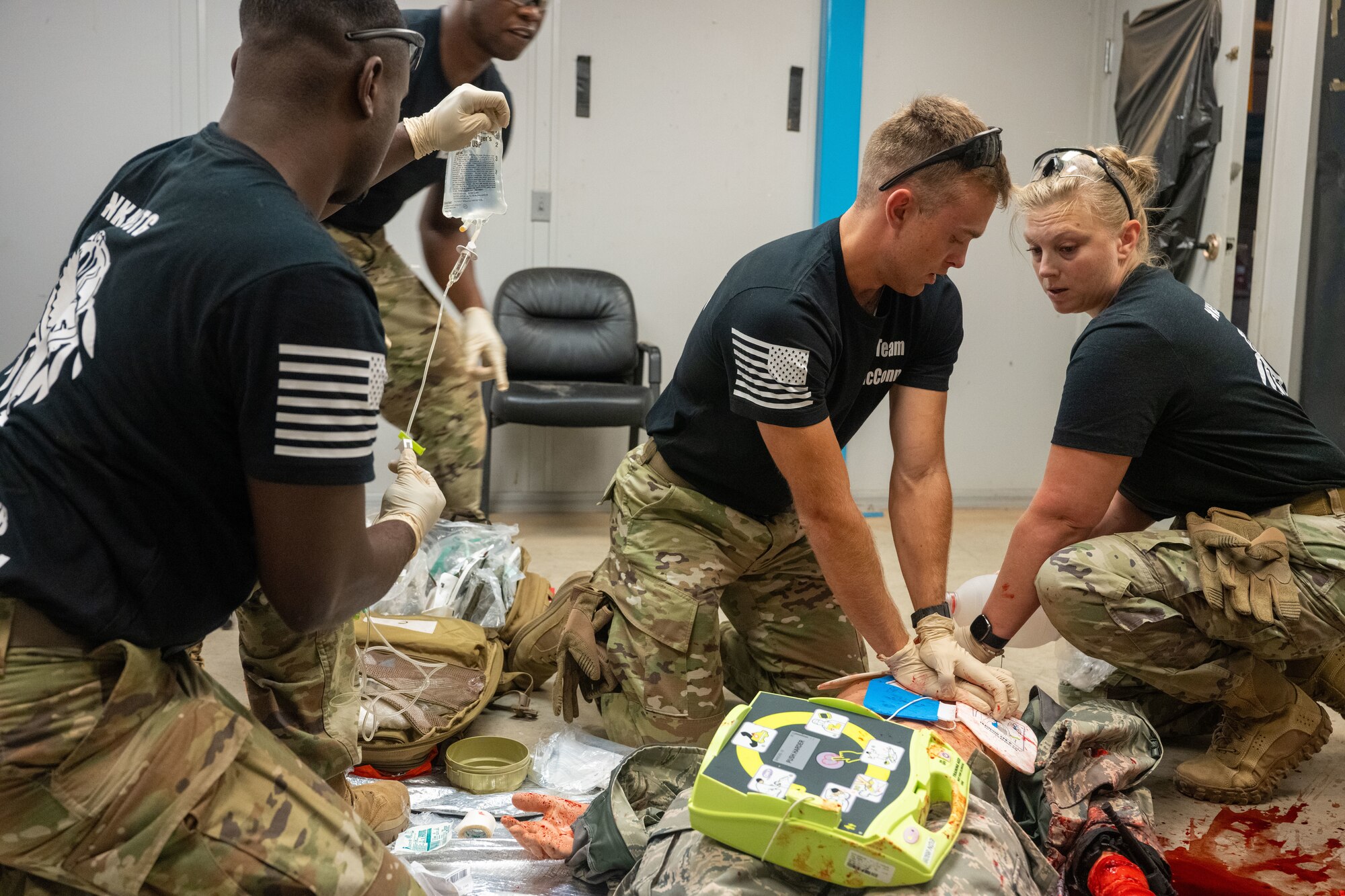 Airmen from the 22nd Medical Group perform life-saving medical attention on a simulated suicide-attempt Airman during the annual Medic Rodeo at Cannon Air Force Base, New Mexico, Aug. 13, 2024. The multi-day rodeo challenges medical personnel through different scenarios. (U.S. Air Force photo by Senior Airman Felicia Przydzial)