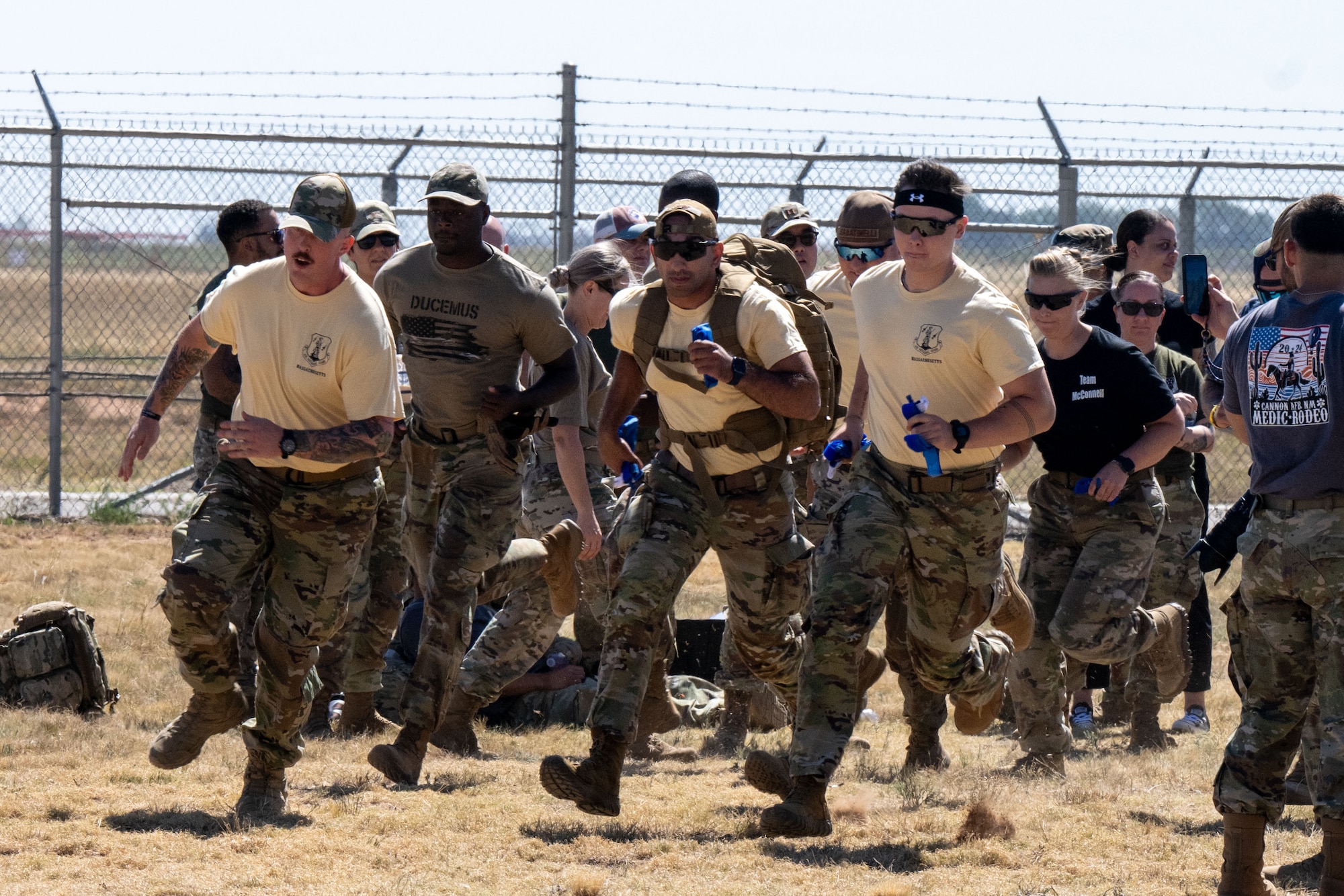 Airmen from the 22nd Medical Group race against Airmen from the 104th Fighter Wing during the annual Medic Rodeo Commando Challenge at Cannon Air Force Base, New Mexico, Aug. 15, 2024. The challenge is a multi-event race testing endurance, physical fitness and medical knowledge. (U.S. Air Force photo by Senior Airman Felicia Przydzial)