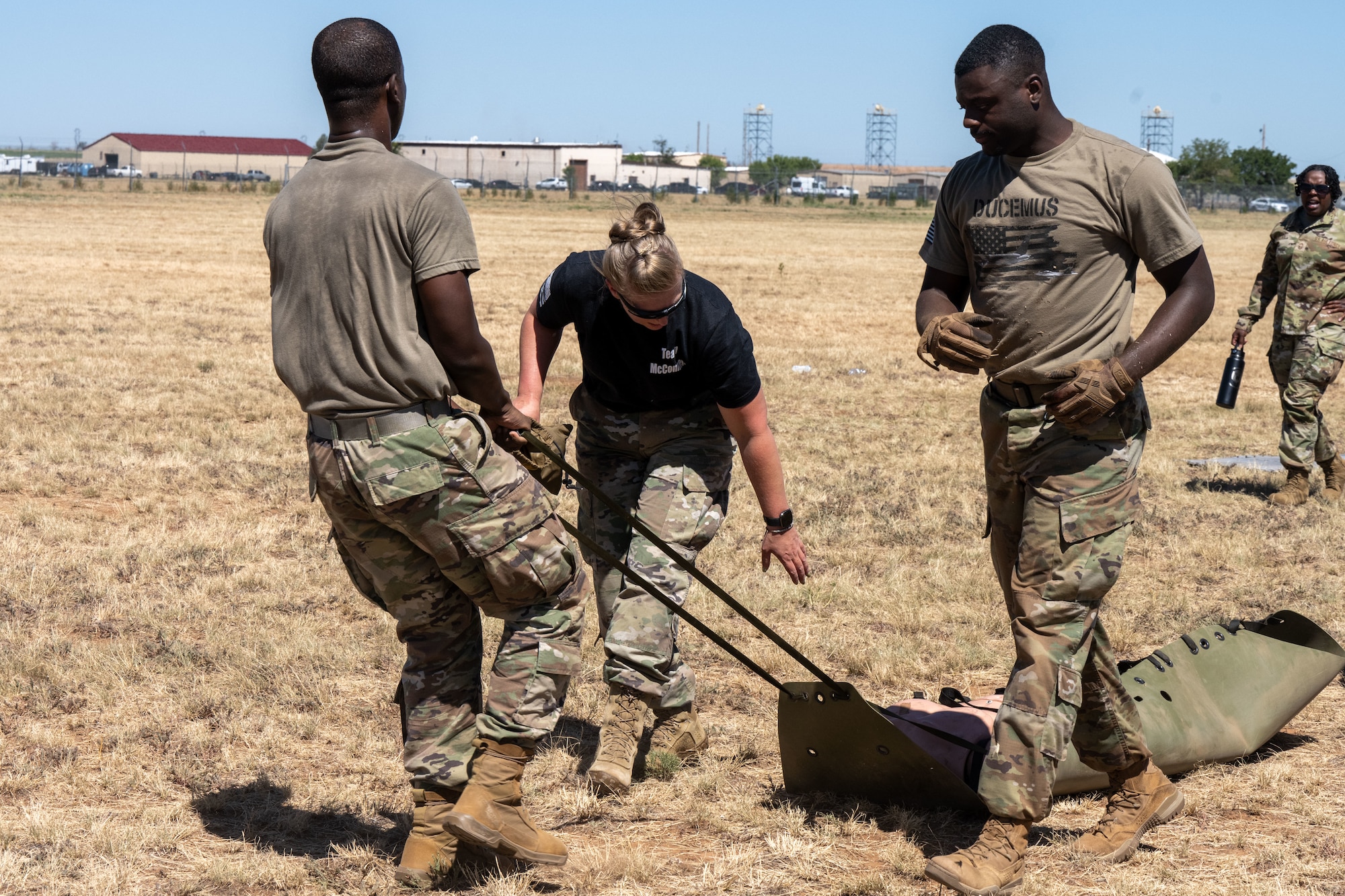 Airmen from the 22nd Medical Group race in the annual Medic Rodeo Commando Challenge at Cannon Air Force Base, New Mexico, Aug. 15, 2024. The race required teams to work together through endurance and physical fitness challenges. (U.S. Air Force photo by Senior Airman Felicia Przydzial)