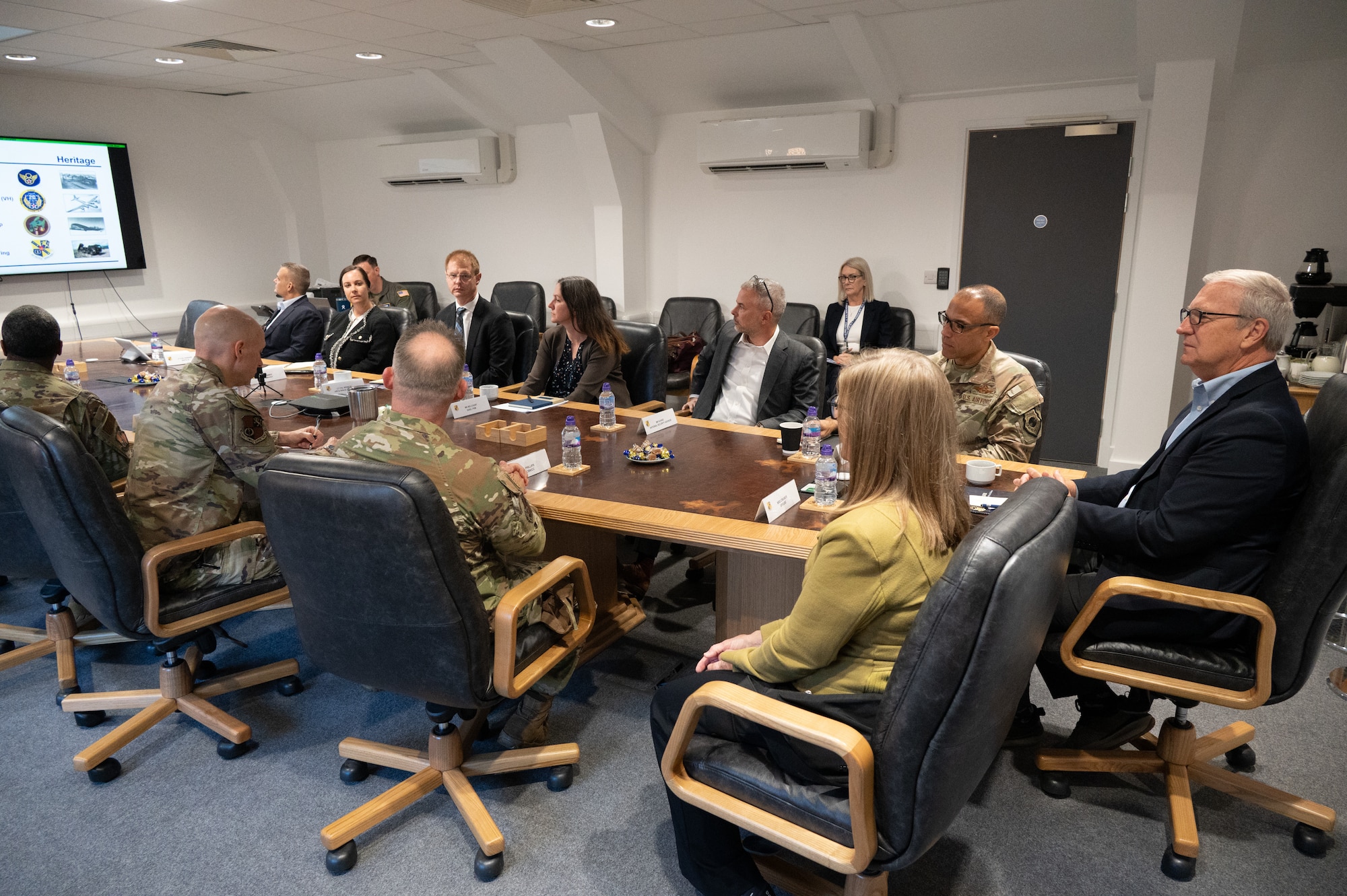 U.S. Air Force Col. D. Landon Phillips, 501st Combat Support Wing commander, briefs Senator Kevin Cramer and his team in the conference room