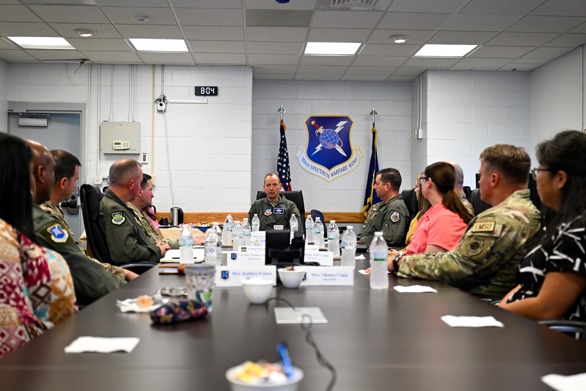 U.S. Air Force Maj. Gen. Christopher Niemi, commander of the U.S. Air Force Warfare Center, center, receives mission briefs from the 350th Spectrum Warfare Wing, the 53d Wing and the 505th Command and Control Wing, during a visit to the Florida Panhandle at Eglin Air Force Base, Florida, Aug. 27, 2024. All three wings fall under the USAFWC, whose mission is to conduct warfighter-centric live and virtual operational test and evaluation, tactics development, and advanced training to optimize Air Force capabilities and prepare Airmen for joint, all domain combat operations. (U.S. Air Force photo by Senior Airman Anna Smith)