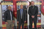 Defense Logistics Agency Installation Management Emergency Manager Carlton Dickens, left, and DLA Emergency Management Program Manager James Johnston, right, pose for a photo with Michael Chang, center, the director of operations for TrapWire Inc., during the National Preparedness Month observance
