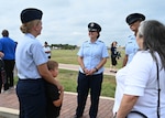 U.S. Air Force Col. Angelina Maguinness, 17th Training Wing commander, speaks with Airman Leilani Greno, a graduate of Basic Military Training, at Joint Base San Antonio-Lackland, Texas, Sep. 5, 2024. Greno will become a part of the 312th Training Wing at Goodfellow Air Force Base to become a fire protection apprentice. (U.S. Air Force photo by Senior Airman Zach Heimbuch)