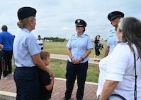 U.S. Air Force Col. Angelina Maguinness, 17th Training Wing commander, speaks with Airman Leilani Greno, a graduate of Basic Military Training, at Joint Base San Antonio-Lackland, Texas, Sep. 5, 2024. Greno will become a part of the 312th Training Wing at Goodfellow Air Force Base to become a fire protection apprentice. (U.S. Air Force photo by Senior Airman Zach Heimbuch)