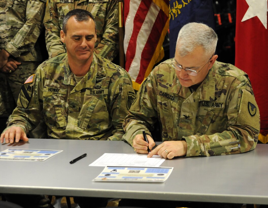 Kentucky National Guard hosted a ceremonial equipment signing Dec. 17, 2019 at the USPFO in Frankfort, Ky., with Col. Steven Carozza, military deputy for TACOM's Integrated Logistics Support Center and Brig. Gen Bryan Howay, director of the Joint Staff for the Kentucky National Guard.