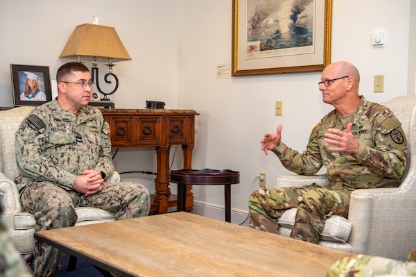 240909-N-MT837-1002 Naval Medical Center Portsmouth (NMCP) welcomed U.S. Army Brigadier General Lance Raney, Medical Readiness Command (MRC) East commanding general, Sept. 9. Raney (right) speaks with Capt. Brian L. Feldman, NMCP director/Navy Medicine Readiness and Training Command Portsmouth commander.