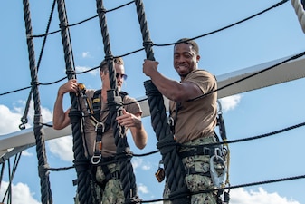 Sailors selected for promotion to chief petty officer climb the shrouds on the mizzen mast aboard USS Constitution during Chief Petty Officer Heritage Weeks.