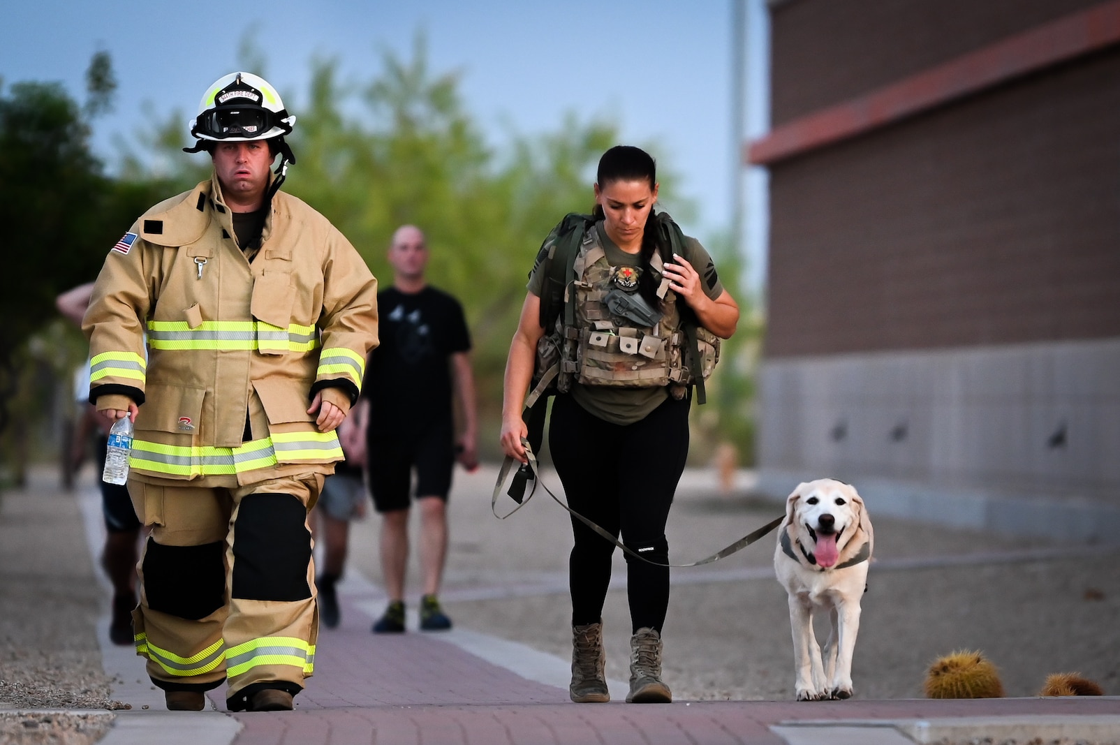 Master Sgt. Michael Brick, assistant fire chief of health and safety for the 944th Fighter Wing, participates in the 9/11 Remembrance 5K in full firefighting gear on Sept. 8, 2024, at Luke Air Force Base, Ariz. Brick’s participation honored the firefighters who died on 9/11. (U.S. Air Force photo by Senior Airman Alexis Orozco)