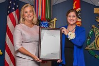 Secretary of the Army Christine Wormuth (left) presents the 62nd Annual Pace military award to Maj. Arthur Middlebrooks, Lead Program Analyst for Army Aviation platforms, modernization, enabling effects, and Special Access Programs, Headquarters Department of the Army, Deputy Chief of Staff, G-8, during a ceremony at the Pentagon, Arlington, Va., Sept. 5, 2024. The Pace award is based on performance and completion of significant staff assignments that benefit the Army by providing substantial financial savings, or technological or military development. (U.S. Army photo by Sgt. David Resnick)
