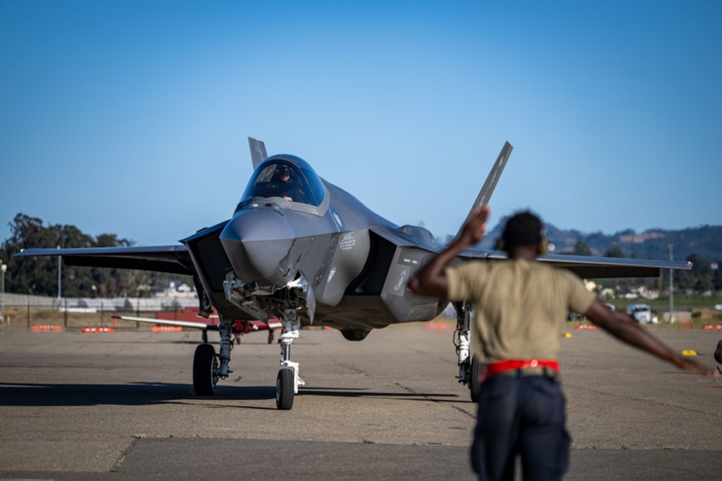 A U.S. Air Force crew chief assigned to the 34th Fighter Generation Squadron marshals an F-35A Lightning II during exercise Agile Flag 24-3 in Santa Maria, California, Aug. 5, 2024. Agile Flag 24-3 was an Air Combat Command certification exercise that tested the 23rd Wing’s ability to generate combat air power while continuing to move, maneuver, and sustain Wing and subordinate force elements in a dynamic and contested environment. (U.S. Air Force photo by 2nd Lt. Benjamin Williams)