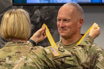Col. Michelle M. Williams, U.S. Army Financial Management Command commander, presents a Maj. Gen. Nathan Towson Regimental Medallion to Col. Kevin D. Pierce, USAFMCOM chief of staff, at the Maj. Gen. Emmett J. Bean Federal Center in Indianapolis Sept. 4, 2024. The Towson was established by the U.S. Army Finance Corps Association on May 7, 1993, to recognize exceptional achievement or exemplary service by currently serving U.S. Army finance and comptroller commissioned officers, non-commissioned officers, enlisted Soldiers and civilians demonstrating exceptional leadership and whose accomplishments clearly distinguish them from their peers. (U.S. Army photo by Mark R. W. Orders-Woempner)