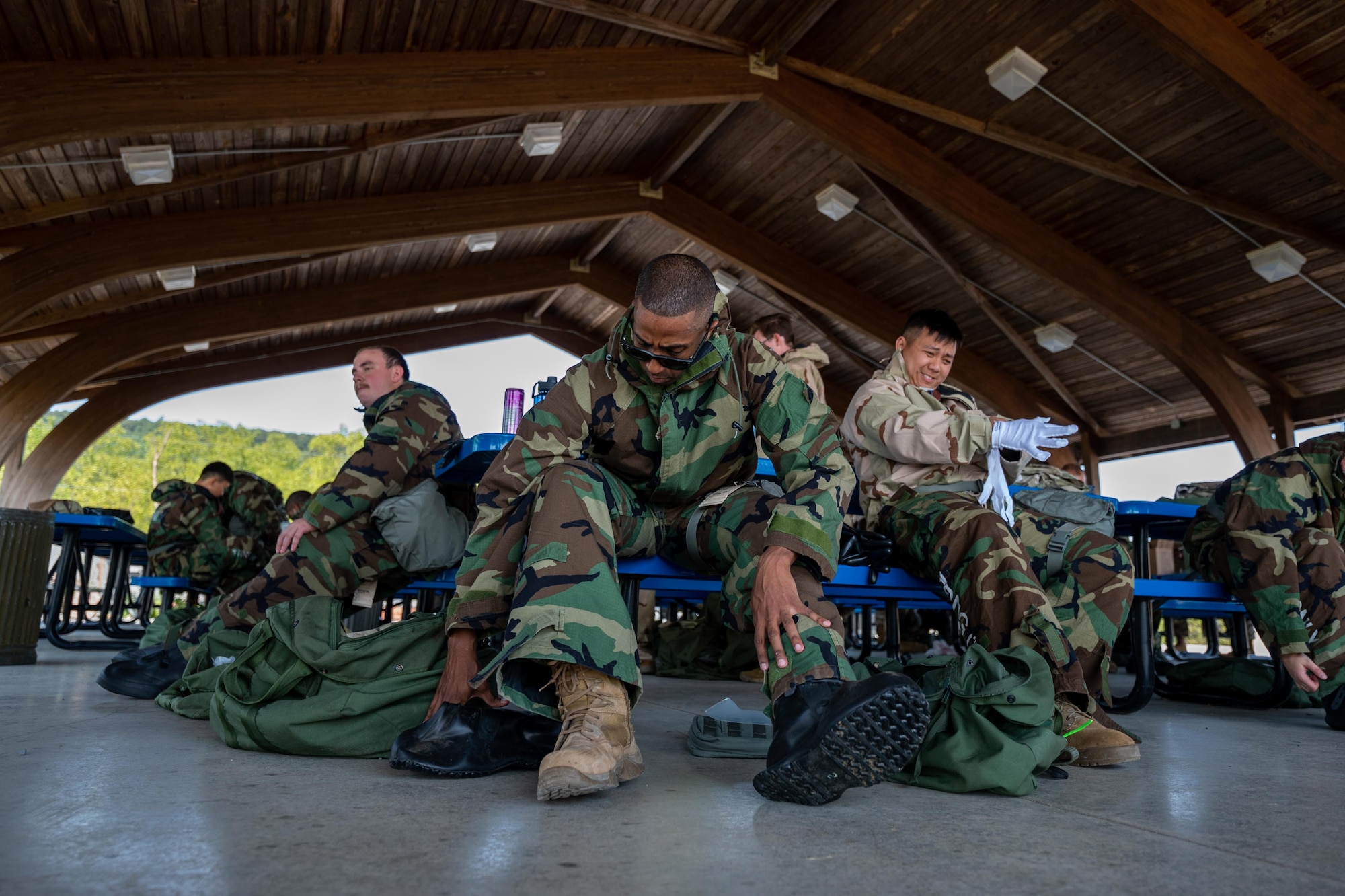 Airmen putting on hazard gear