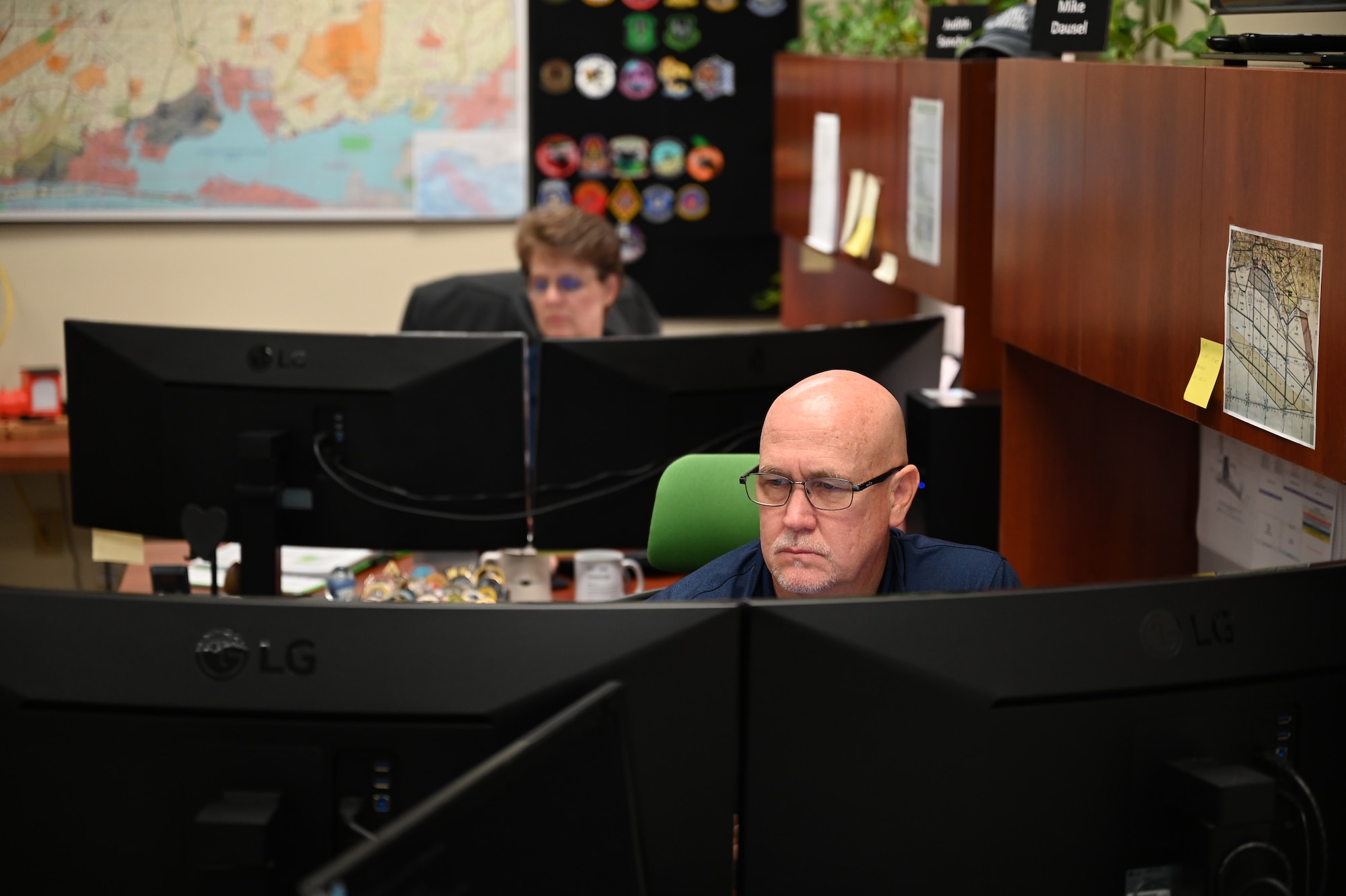 A photo of civilian employees working.