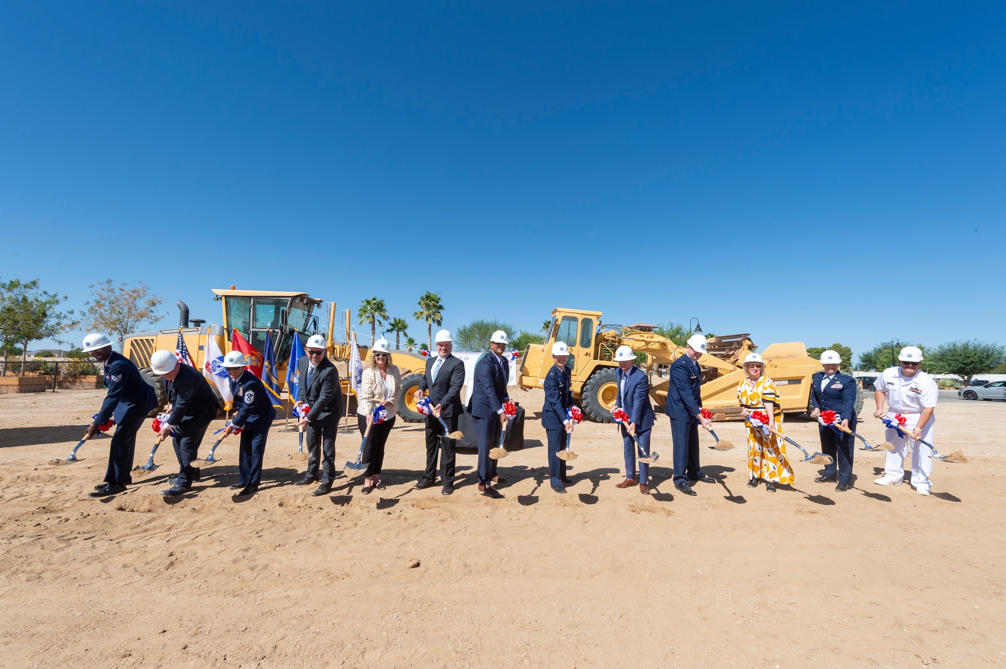 Base leaders, prospective tenants, mission partners and other senior officials break ground on a commercial apartment complex on Edwards Air Force Base, California, Sept. 10. (Air Force photo by Chloe Bonaccorsi)