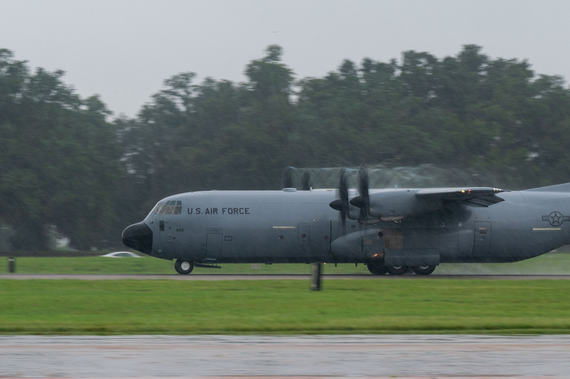 A C130J gains speed to take off