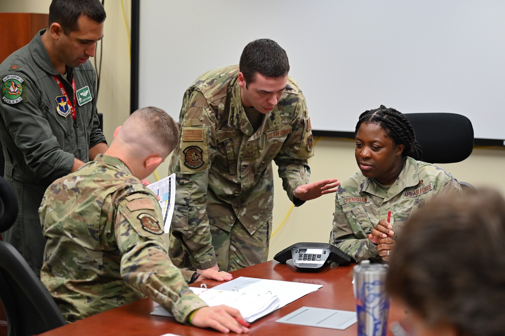 A photo of Airmen talking.