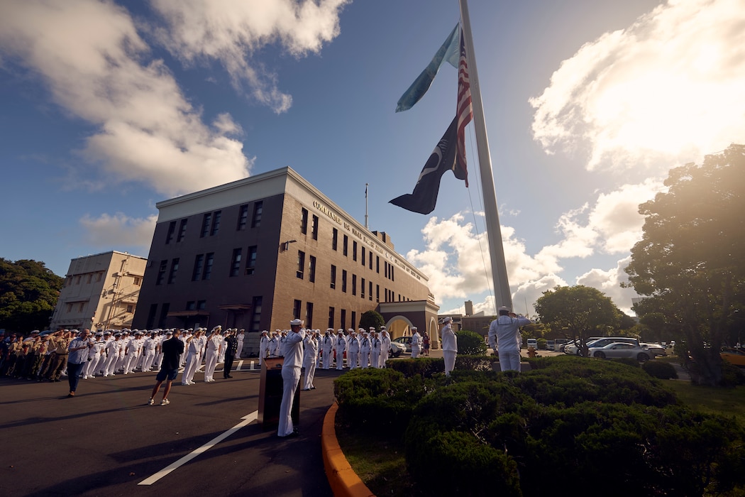 Sailors assigned to Commander, Fleet Activities Yokosuka (CFAY) conduct morning colors during a 9/11 remembrance ceremony held at the installation's command hill, Sept. 11, 2024.