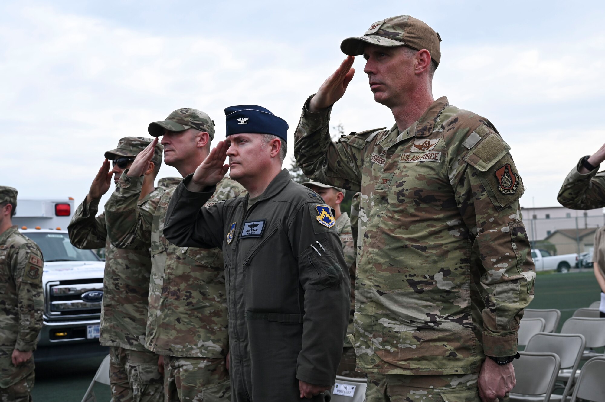 8th Fighter Wing leadership salute during the 9/11 Remembrance Ceremony.
