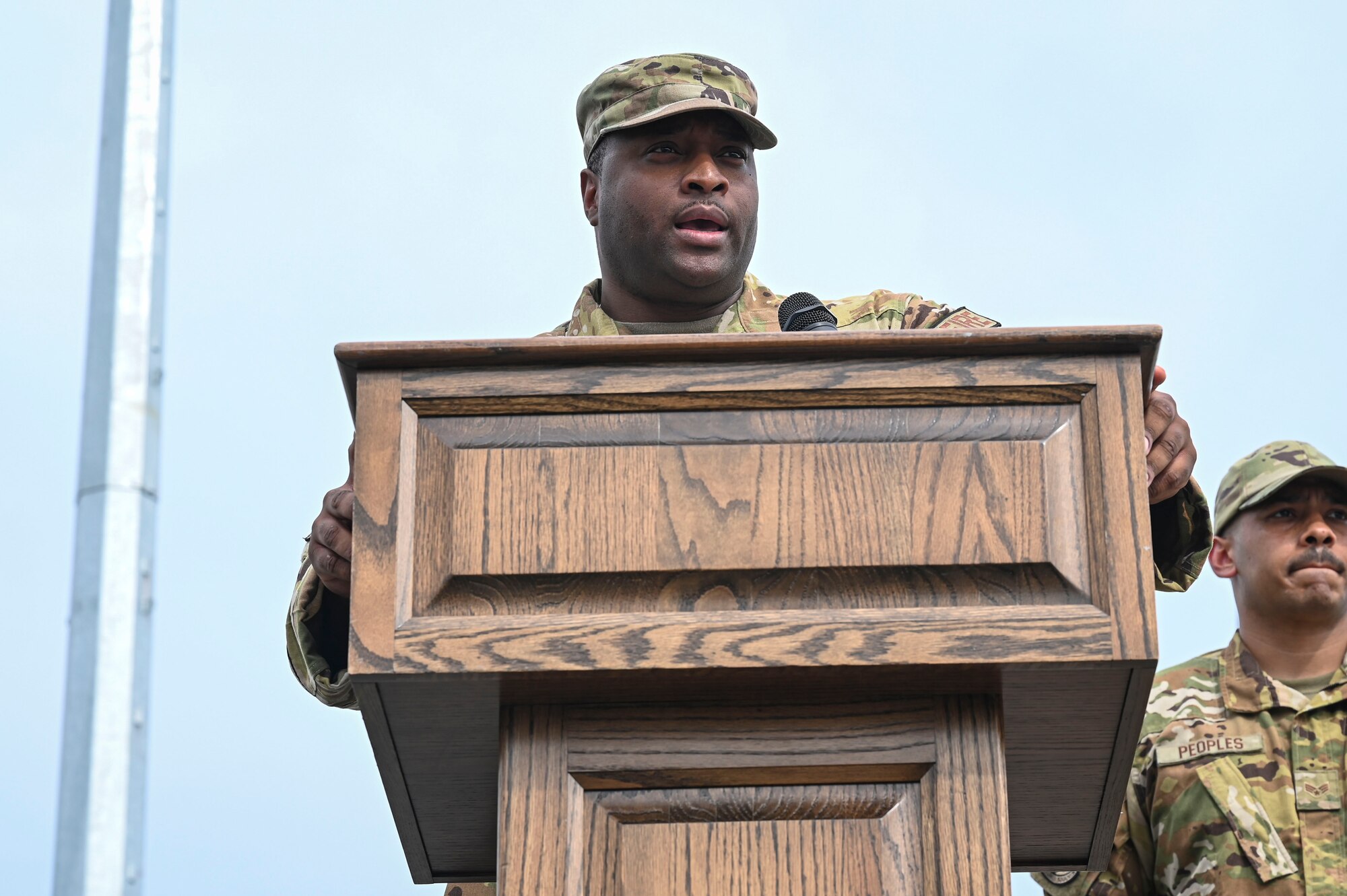 U.S. Air Force Senior Master Sgt. Derek White, 8th Civil Engineer Squadron fire chief, provides remarks during the 9/11 Remembrance Ceremony.