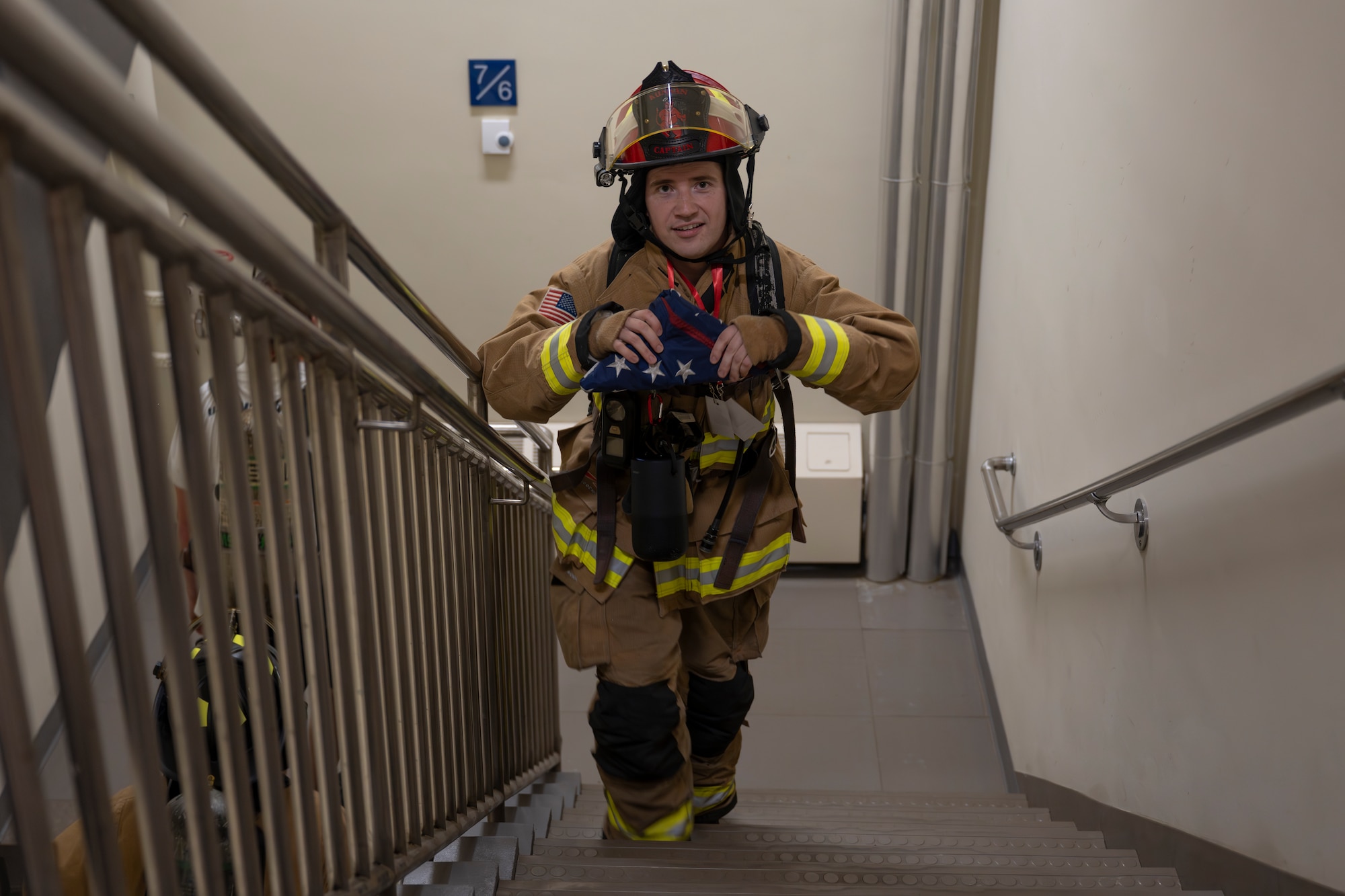 U.S. Air Force Tech. Sgt. David Kehl, 8th Civil Engineer Squadron fire officer, leads the 9/11 Remembrance stair climb.