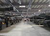 Congressional and U.S. Embassy staff delegation members move through one of the storage warehouses at the Powidz Army Prepositioned Stocks-2 worksite in Powidz, Poland, Sept. 5. The delegation visited the Powidz APS-2 worksite to assess and provide first-hand information and knowledge on APS-2 operations in Poland back to Congress. (Capt. James Bath)