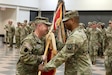 U.S. Army Col. Jeremy Coleman takes command of the 213th Regional Support Group during a ceremony at Fort Indiantown Gap, Pennsylvania, Sept. 8, 2024. The outgoing commander, Col. Frank Montgomery, and his family were thanked and honored for their service during the ceremony. (U.S. Army National Guard photo by Sgt. 1st Class Zane Craig)