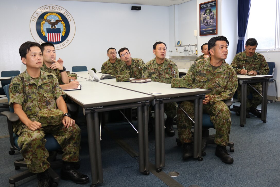 Japanese officers seated at tables