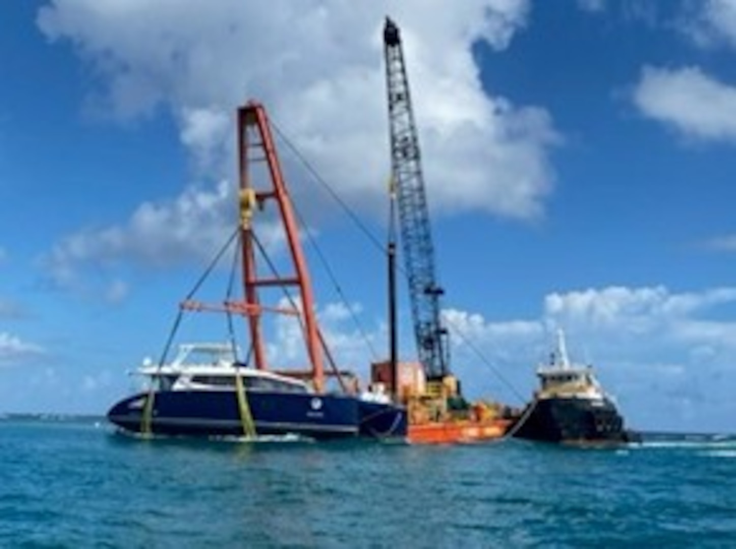 Resolve Marine crews use their 400-ton shear-leg barge to complete the removal of the 72-foot sailing catamaran Obsession from a reef at Flamenco Beach in Culebra, Puerto Rico, Sept. 10, 2024.  Coast Guard Federal On-Scene Coordinator representative for the case announced that Resolve Marine crews will conduct a second lift, Sept. 11, 2024, to load the vessel Obsession to a second barge for transport to the receiving facility at Virgin Gorda, British Virgin Islands. (Courtesy photo)