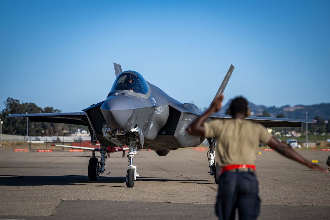 A U.S. Air Force crew chief assigned to the 34th Fighter Generation Squadron marshals an F-35A Lightning II during exercise Agile Flag 24-3 in Santa Maria, California, Aug. 5, 2024. Agile Flag 24-3 was an Air Combat Command certification exercise that tested the 23rd Wing’s ability to generate combat air power while continuing to move, maneuver, and sustain Wing and subordinate force elements in a dynamic and contested environment. (U.S. Air Force photo by 2nd Lt. Benjamin Williams)