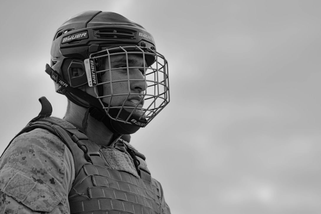 U.S. Marine Corps Recruit John Rodriguez, a recruit with Bravo Company, 1st Recruit Training Battalion, prepares to spar during a pugil sticks event at Marine Corps Recruit Depot San Diego, California, Aug. 27, 2024.  Recruits are taught Marine Corps Martial Arts Program techniques which instill basic self-defense that they will execute throughout recruit training to help build a warrior ethos and esprit de corps. Rodriguez was recruited out of Recruiting Station Los Angeles, California. (U.S. Marine Corps photo illustration by Cpl. Elliott A. Flood-Johnson)