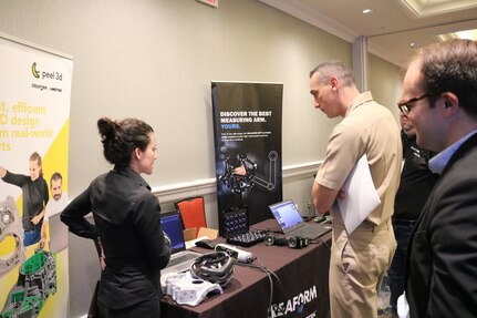 Naval Surface Warfare Center, Carderock Division’s Commanding Officer Capt. Christopher K. Matassa talked with different 3D scanning companies at the 3D Scanning Industry Day Event on Aug. 22, 2024, at Bethesda North Marriott Conference Center in Rockville, Md to learn more about the industry and how it benefits the Navy. Capt. Matassa was also able to see up close how the process worked and get a hands on experience to the objects made by the 3D scanner.